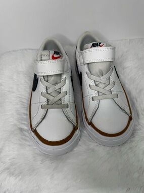 Nike Kids White Sneakers with Brown Trim and Black Swoosh